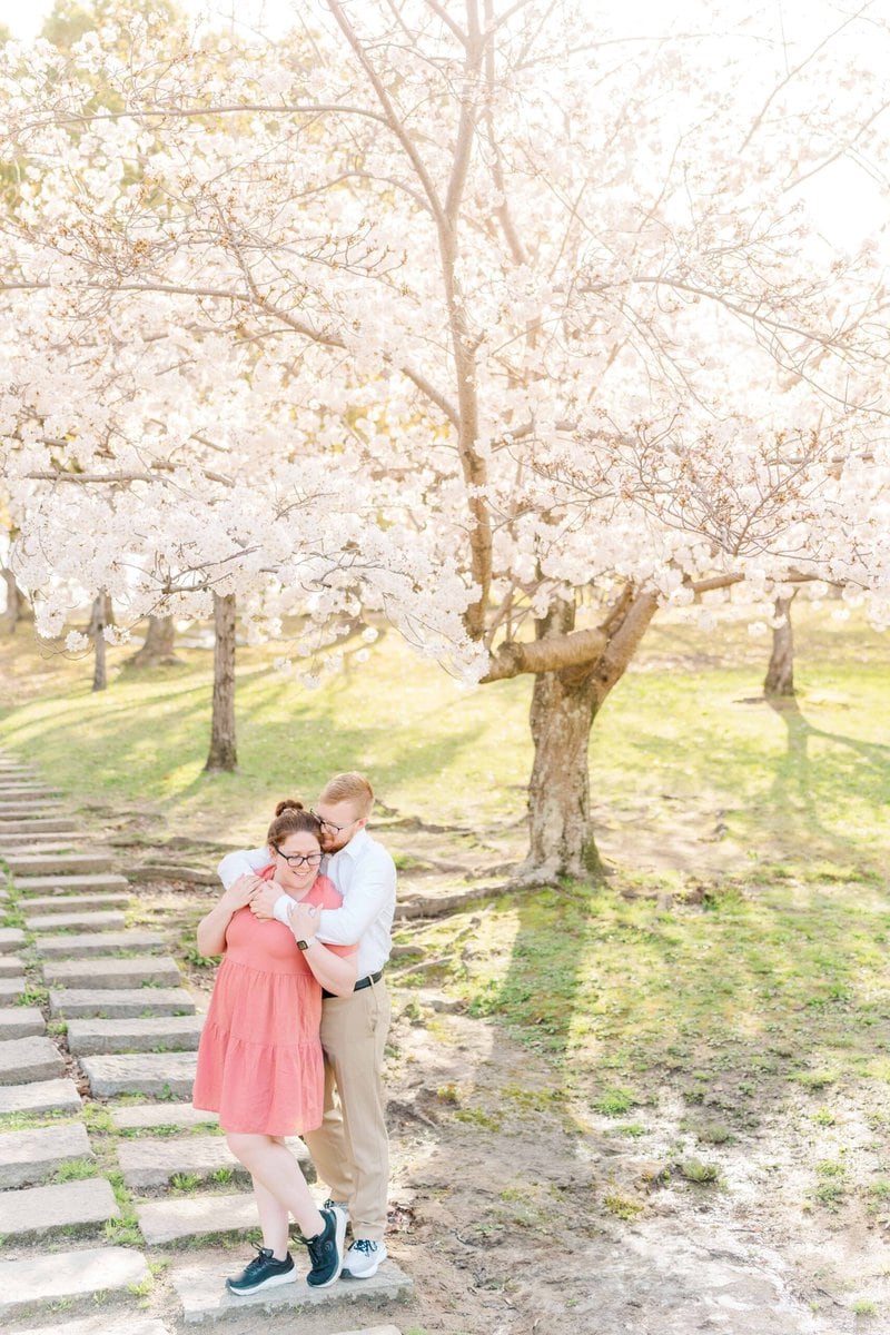 Beautiful sakura trees in bloom during our photoshoot in Japan! Cam and Maura snuggle under a white cherry tree in full bloom!