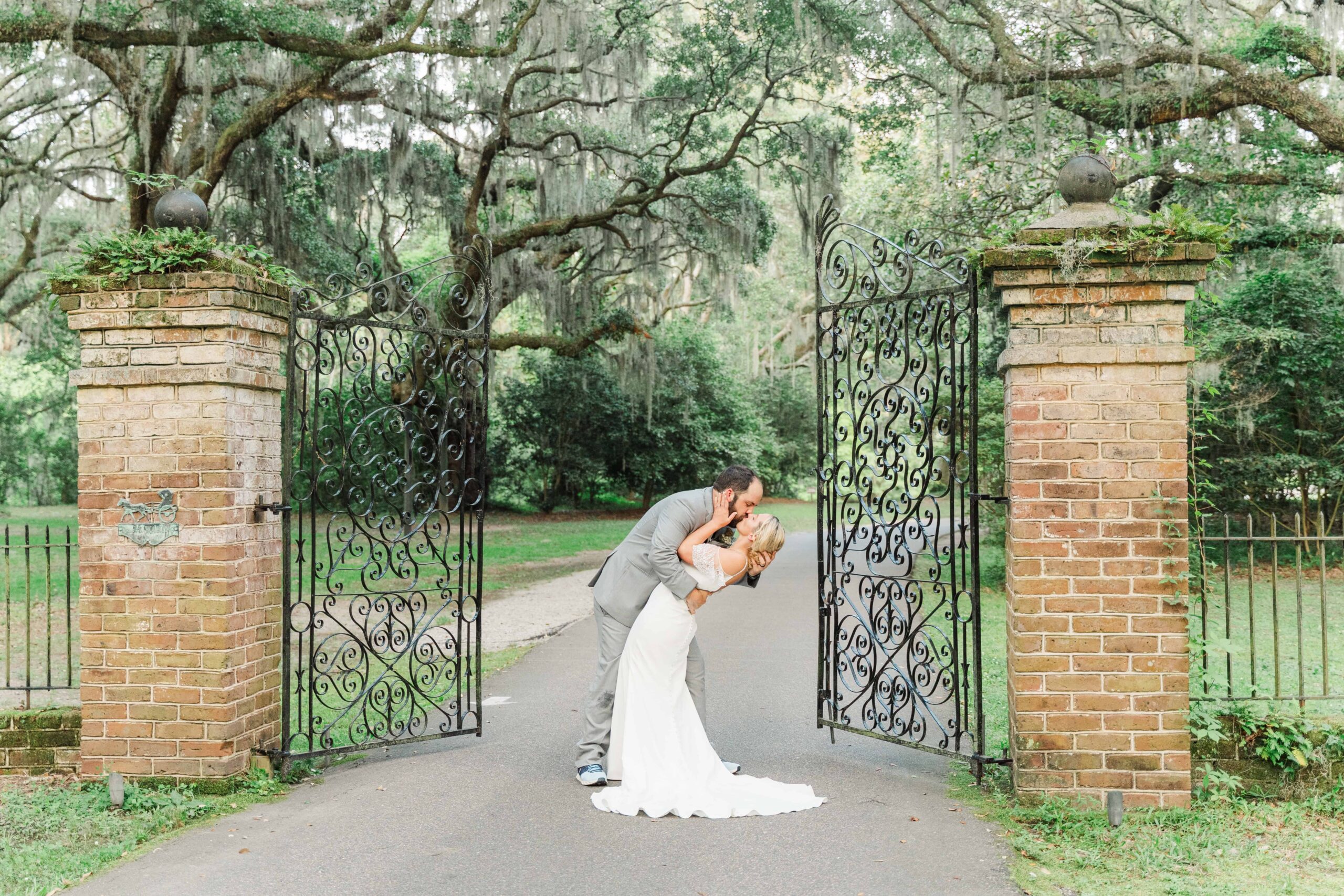 Laurel and Ken share a romantic golden-hour moment by the pond, with the sun setting over the Ashley River.
