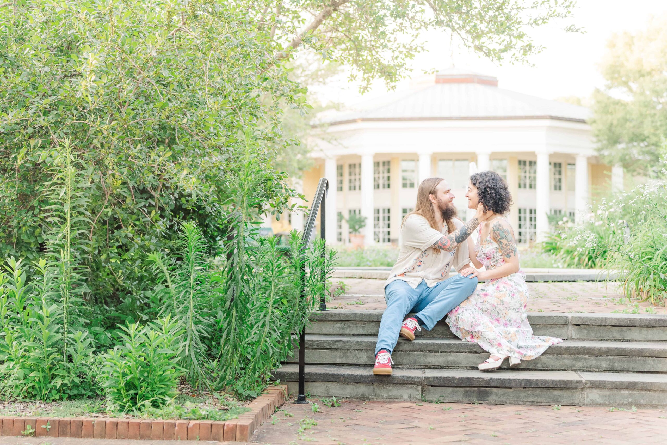 Candid moment with couple walking the garden paths at the Daniel Stowe Conservancy