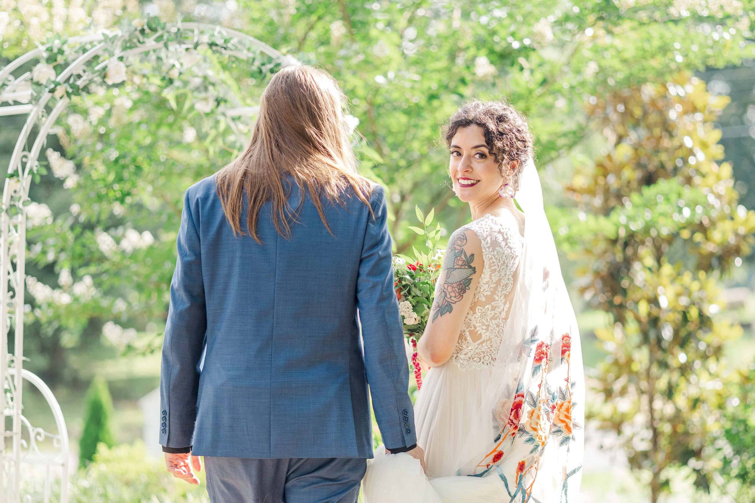 Bride and groom during their first look in the garden at Mariposa Chapel & Events