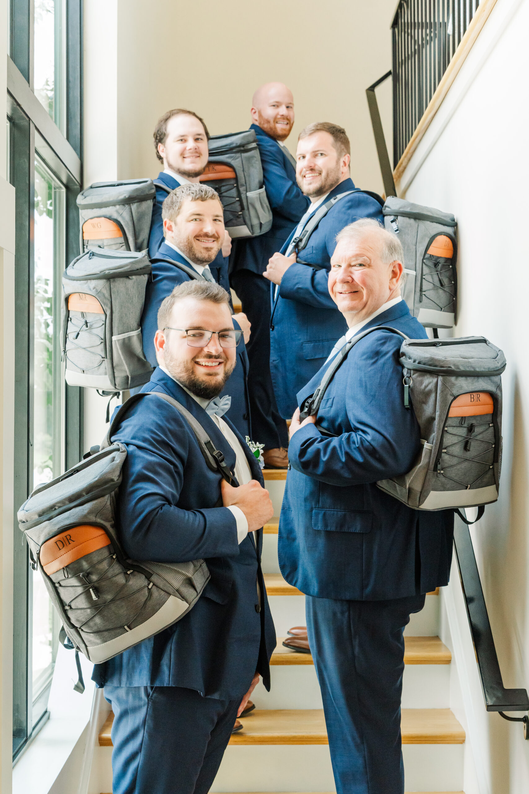 groom and groomsmen with customized beer cooler backpacks