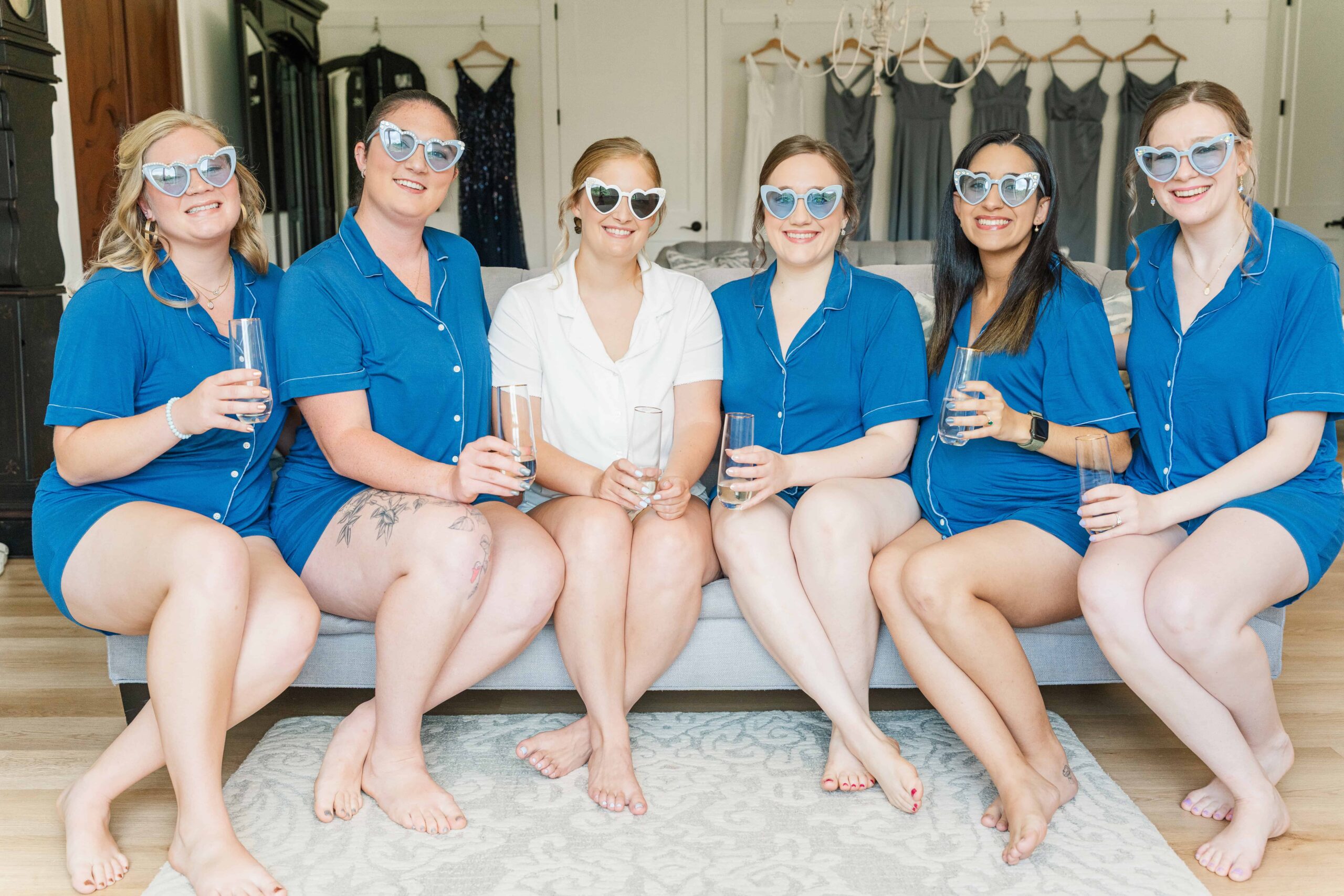 bride and bridesmaids in matching pajamas and sunglasses