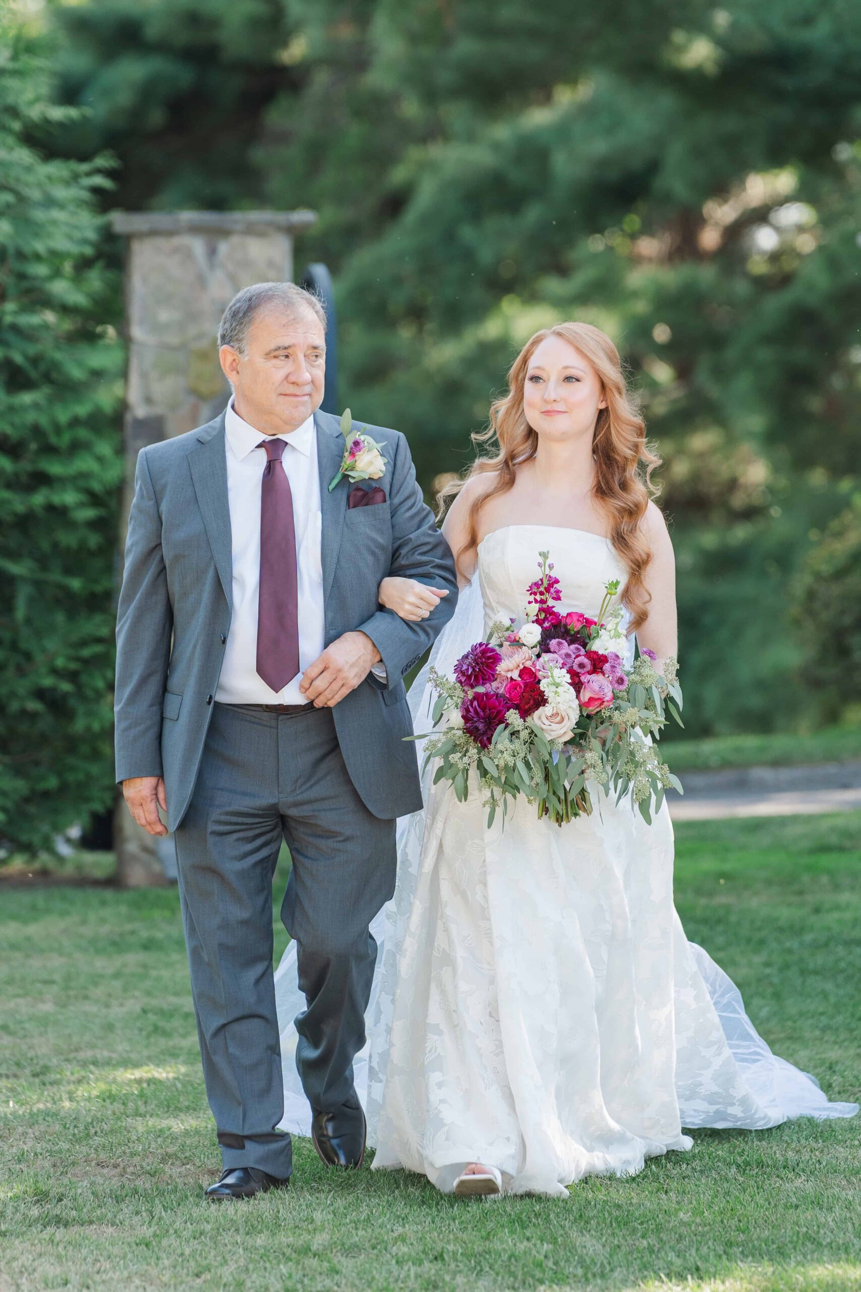 Caroline walking down aisle with father at Olde Beau Resort wedding