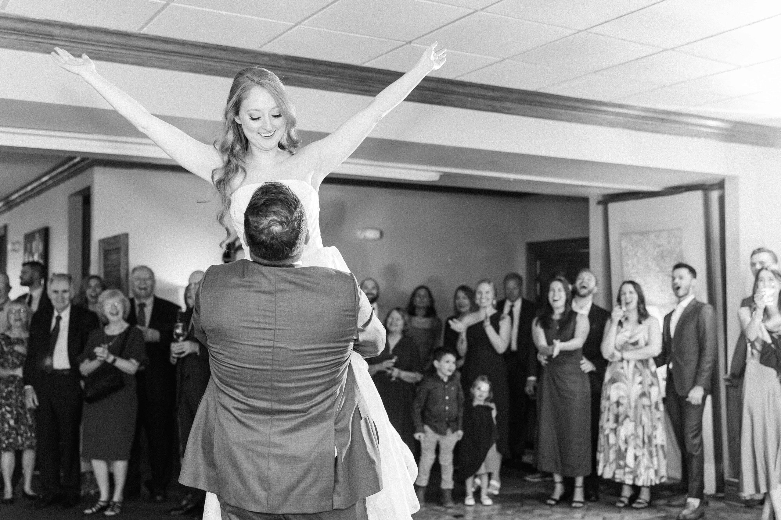 Groom spinning bride during Olde Beau Resort & Golf Club wedding photography session