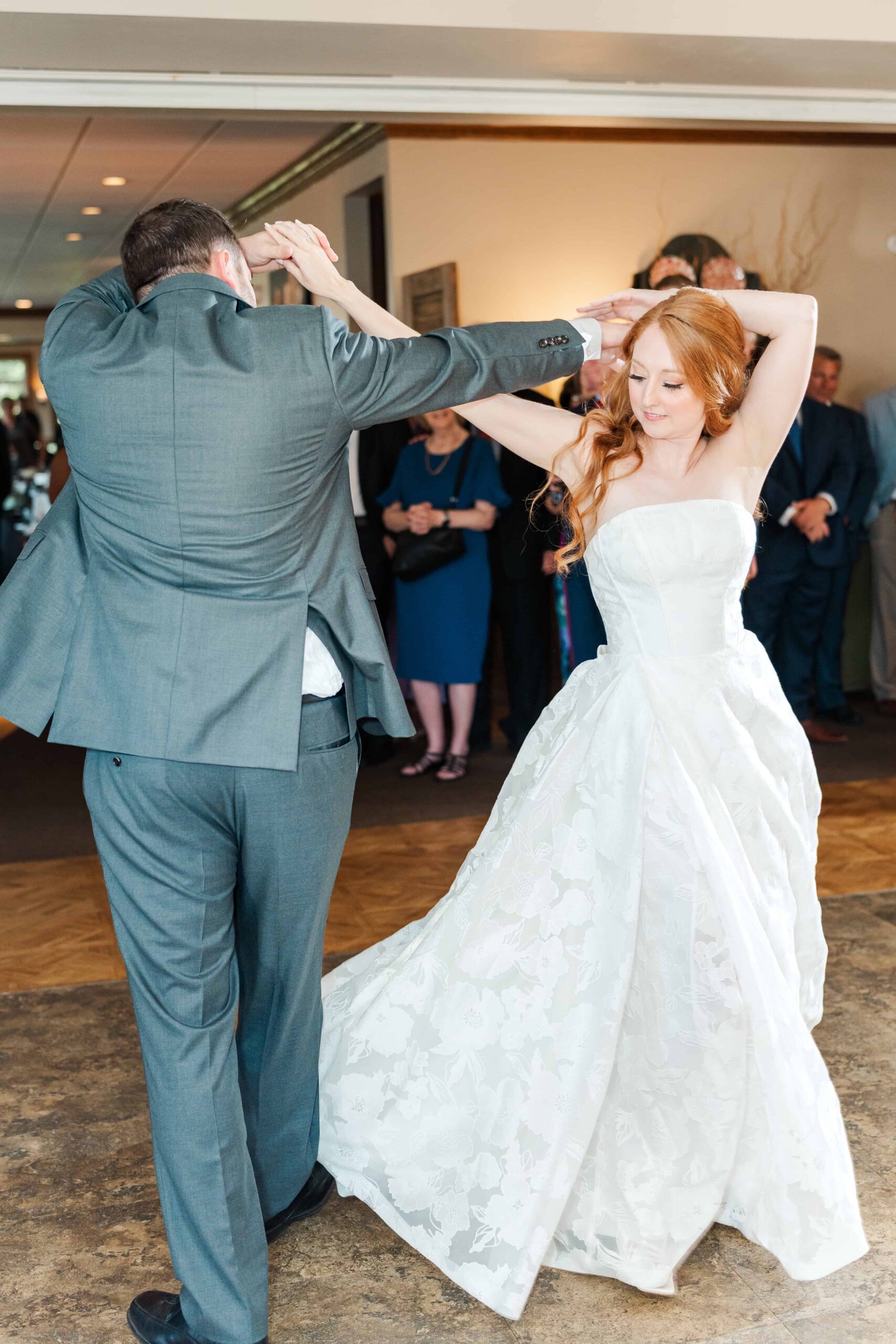 Bride twirling on dance floor in Olde Beau Resort & Golf Club wedding photography