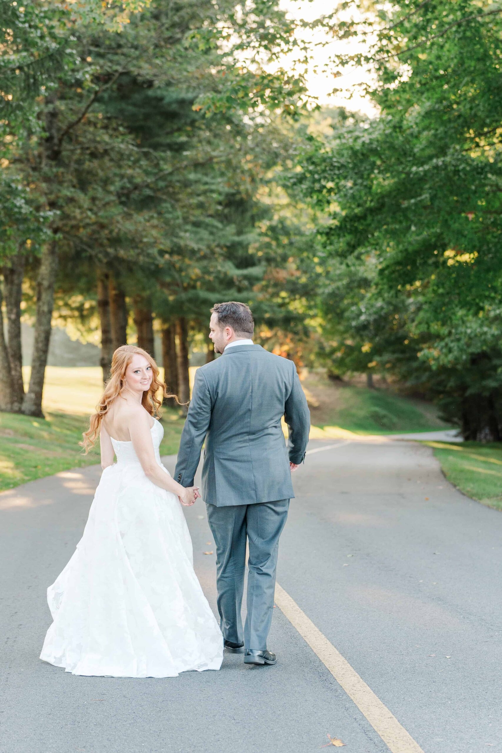 Bride and groom walking together at semi-private resort community