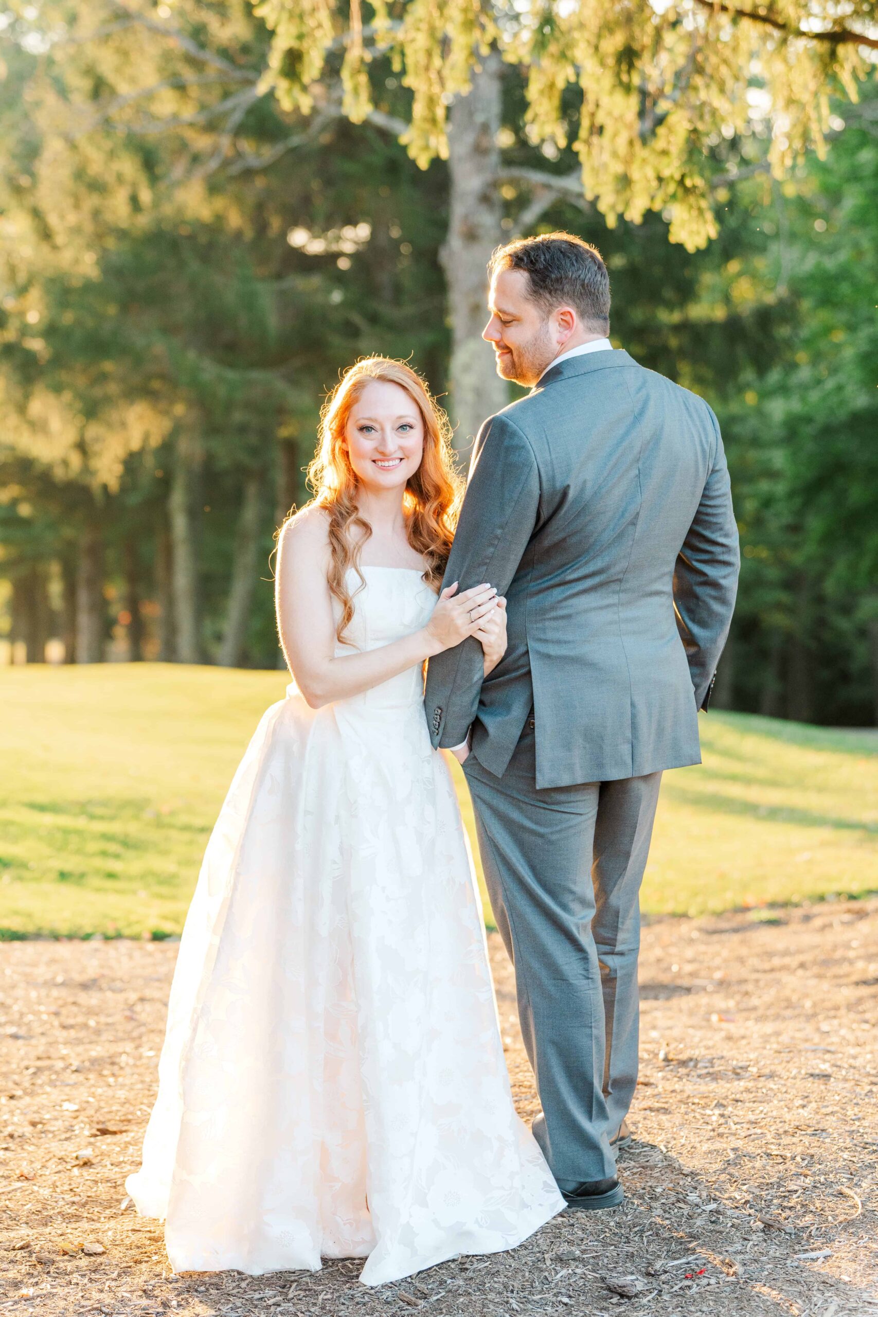 Couple walking across golf course during Olde Beau Resort & Golf Club wedding photography
