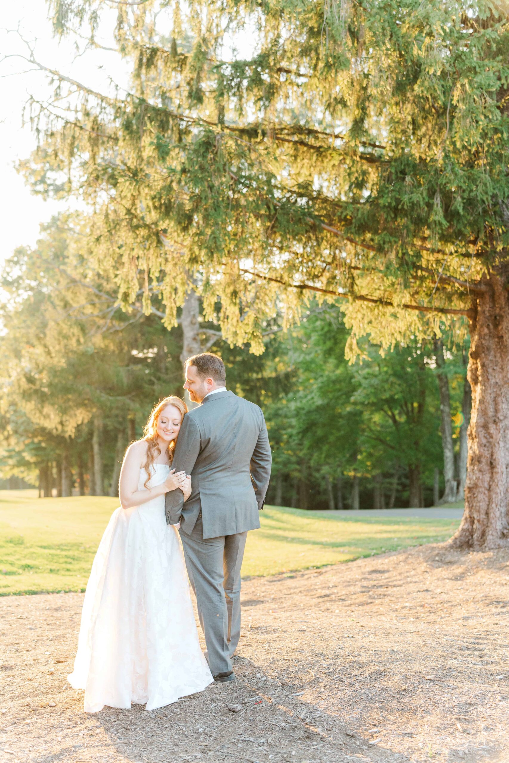 Adventurous couple frolicking on golf course greens