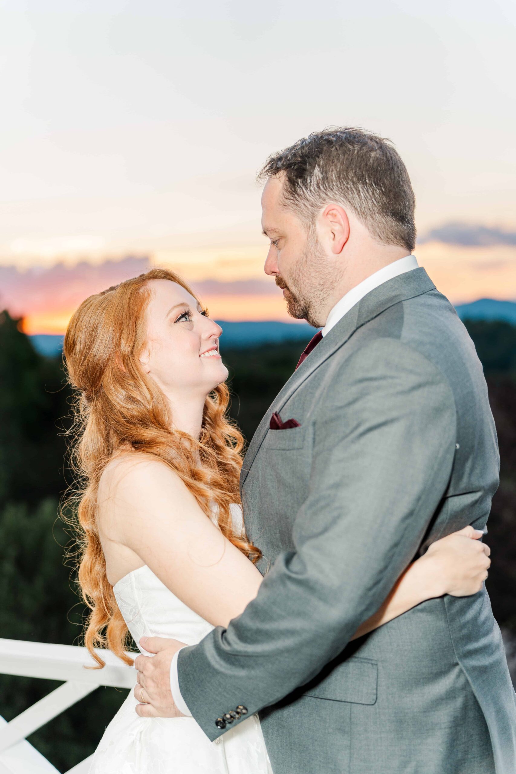 Couple embracing under Blue Ridge Mountain sunset