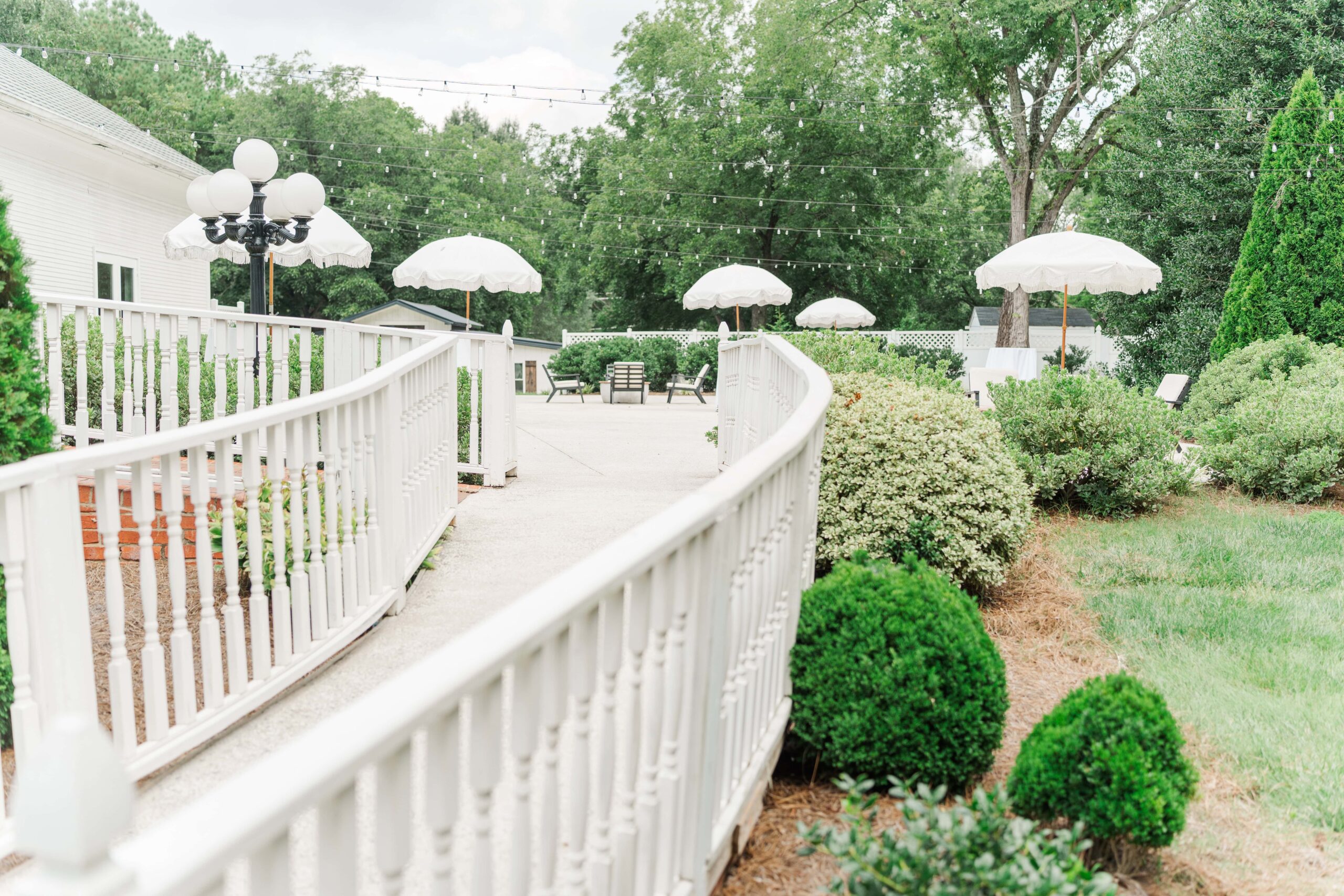 Outdoor spaces at The Grande Victorian showing acres of gardens and rustic charm