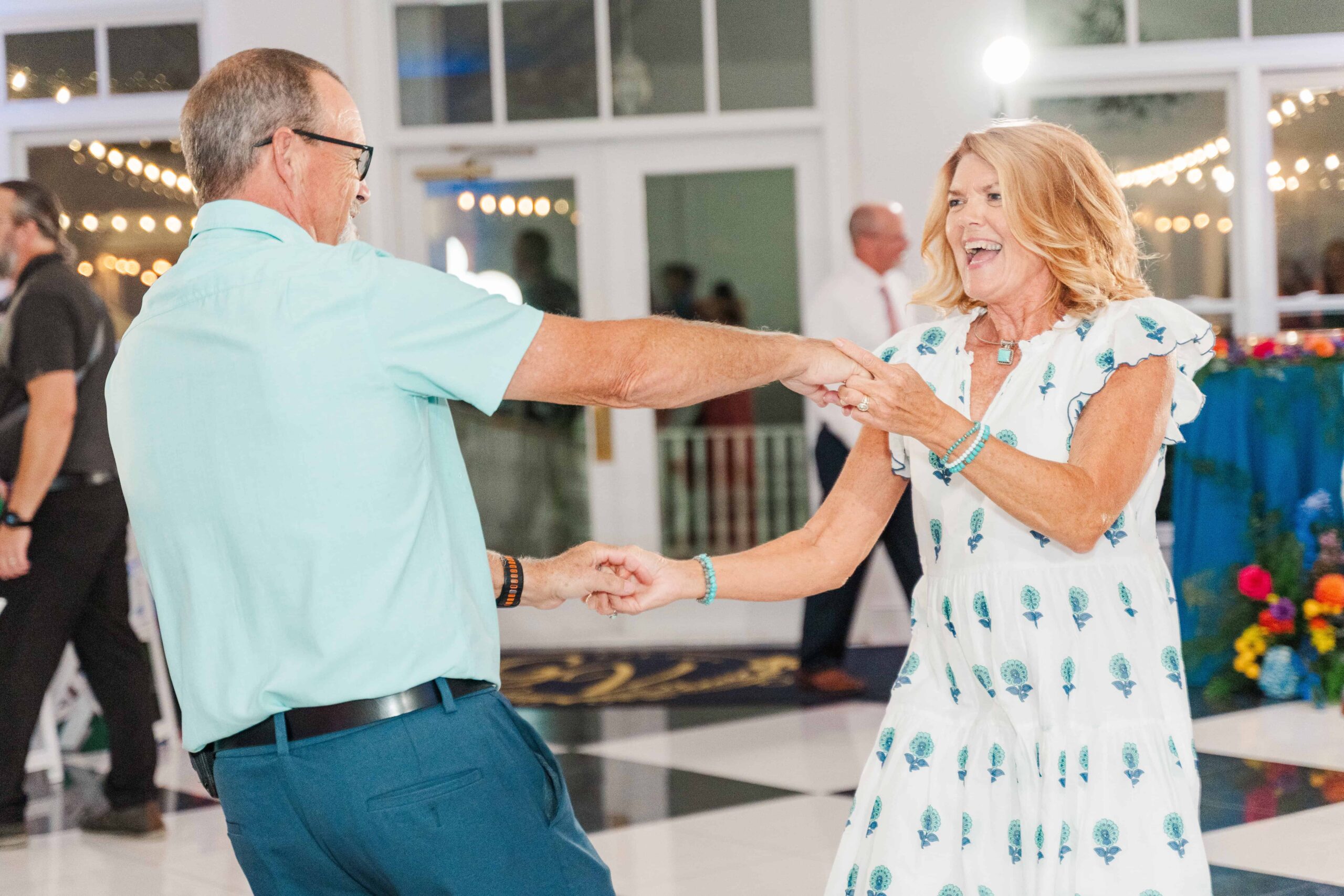 The Grande Victorian wedding photographer Monroe NC capturing candid laughter on the dance floor