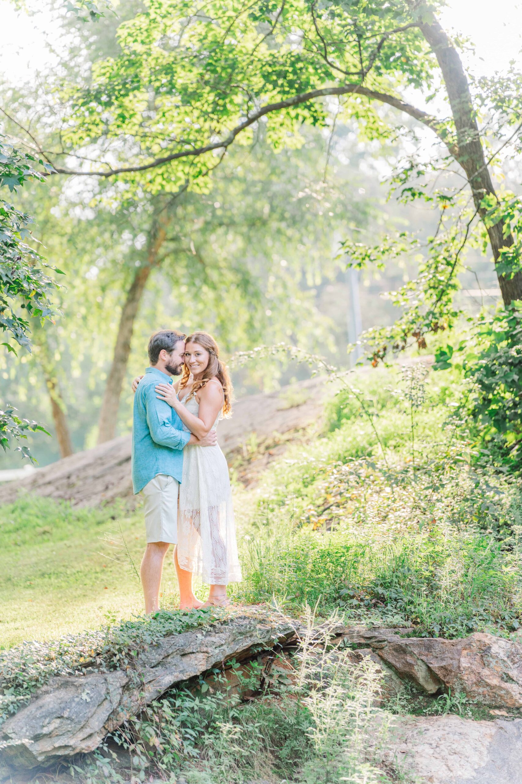 McGalliard Falls waterfall surrounded by lush green summer trees in Valdese NC