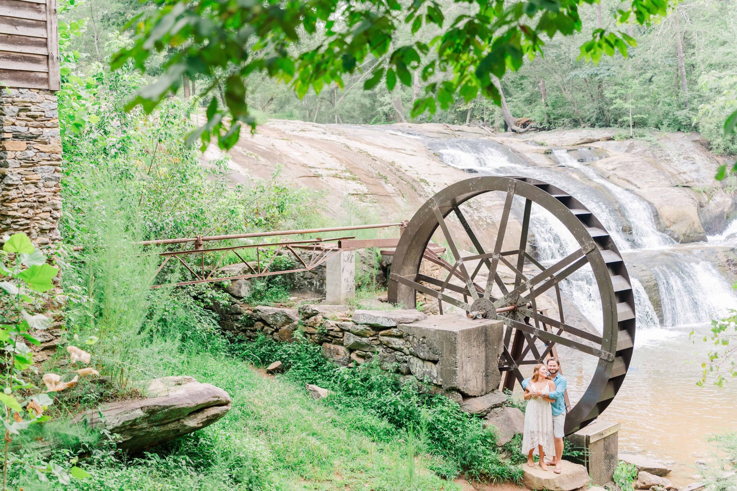 McGalliard Falls in Valdese NC surrounded by lush green summer trees