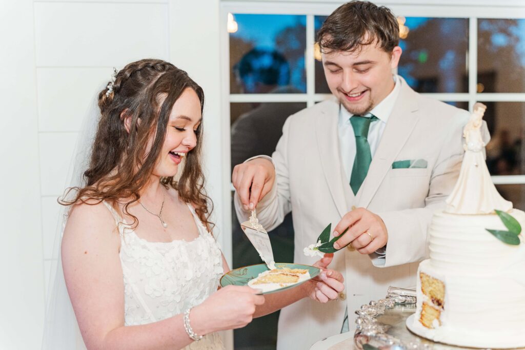 bride and groom cutting the cake at heron hill venue