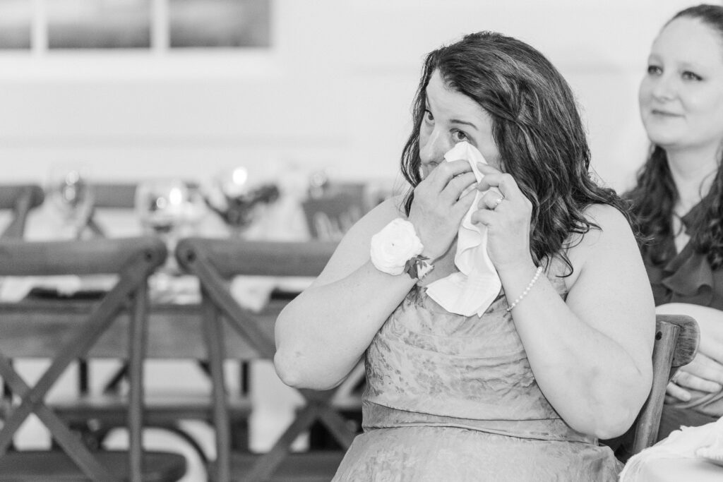 Mother of the groom crying joyful tears at heron hill wedding