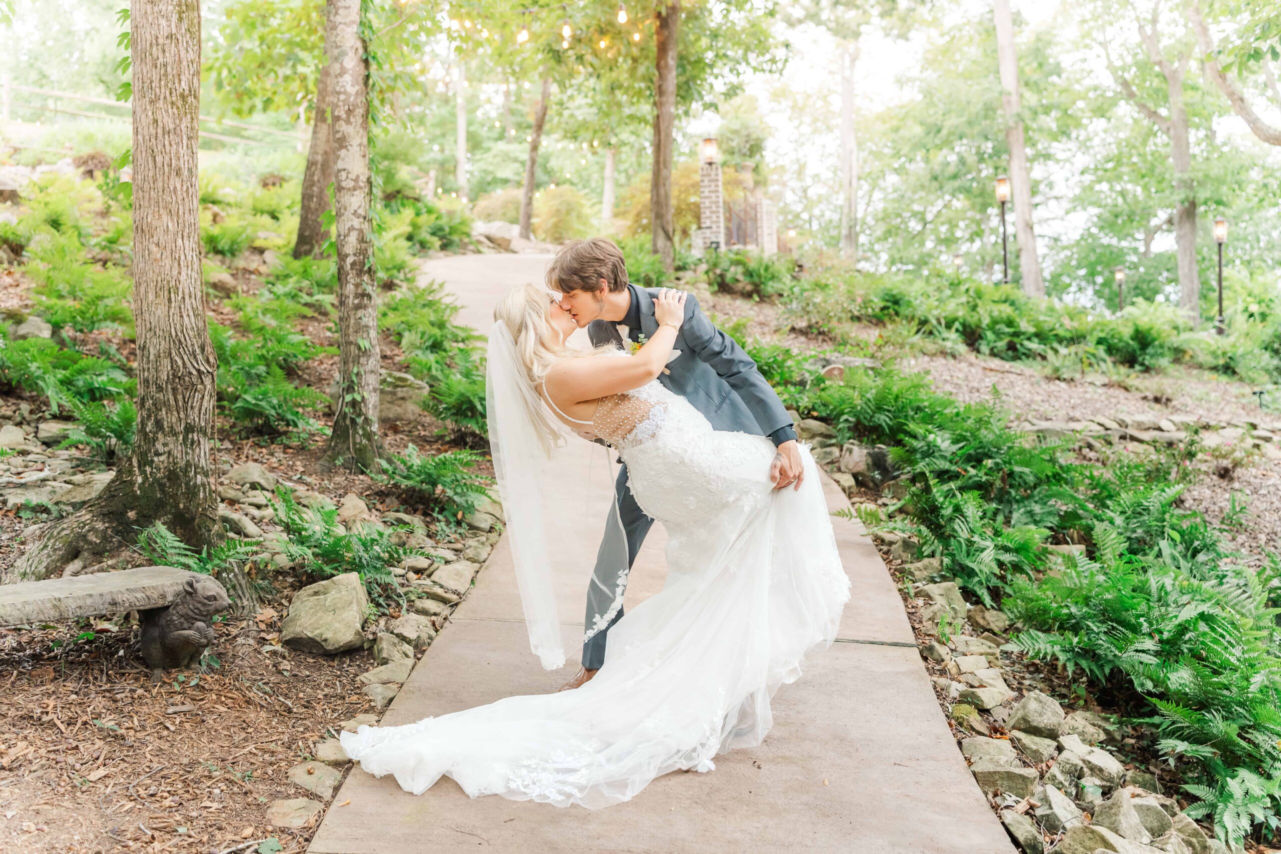 End of the day portrait of the married couple under twinkle lights at Catawba Falls Events