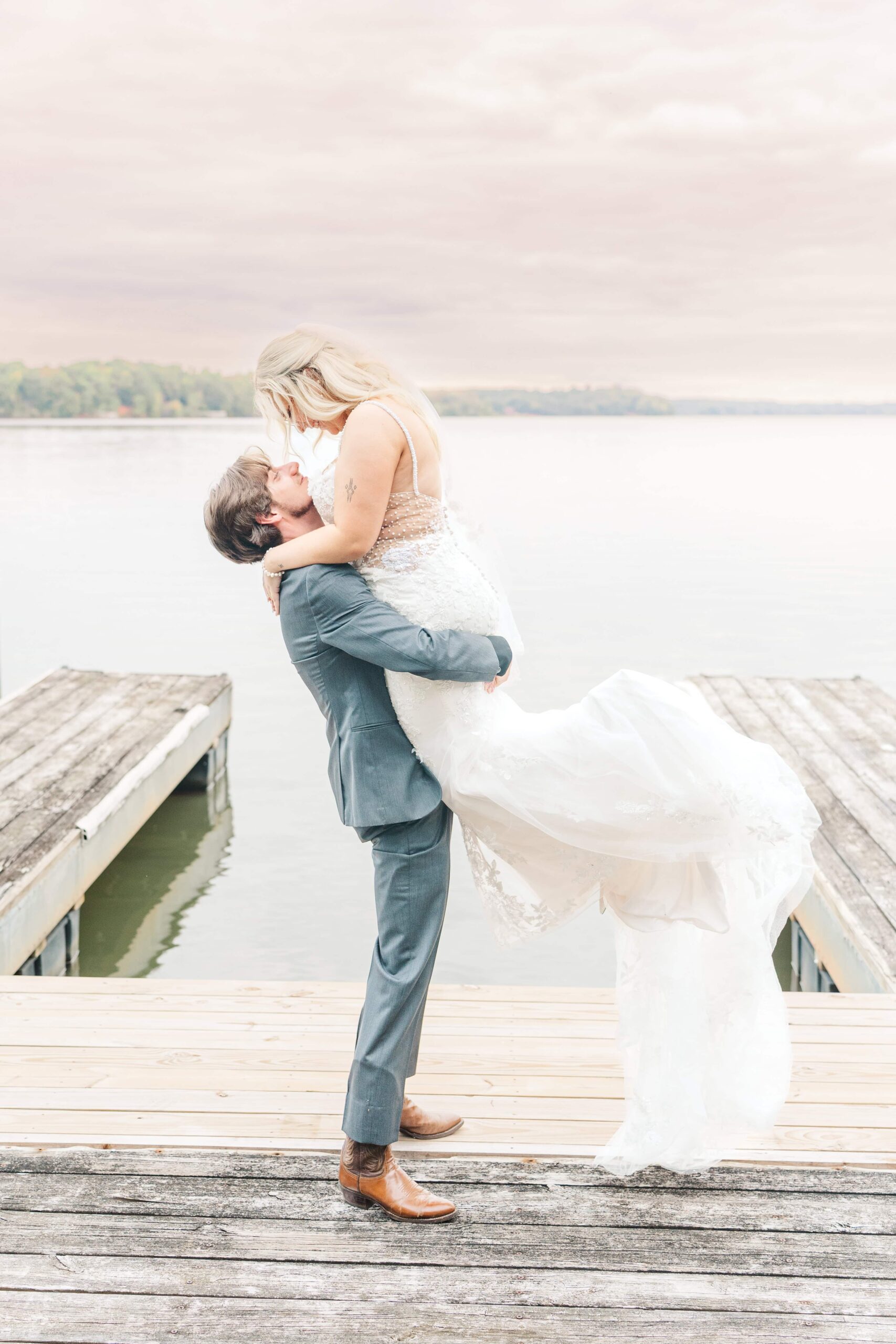 Cloudy wedding day creating romantic light for dock photos