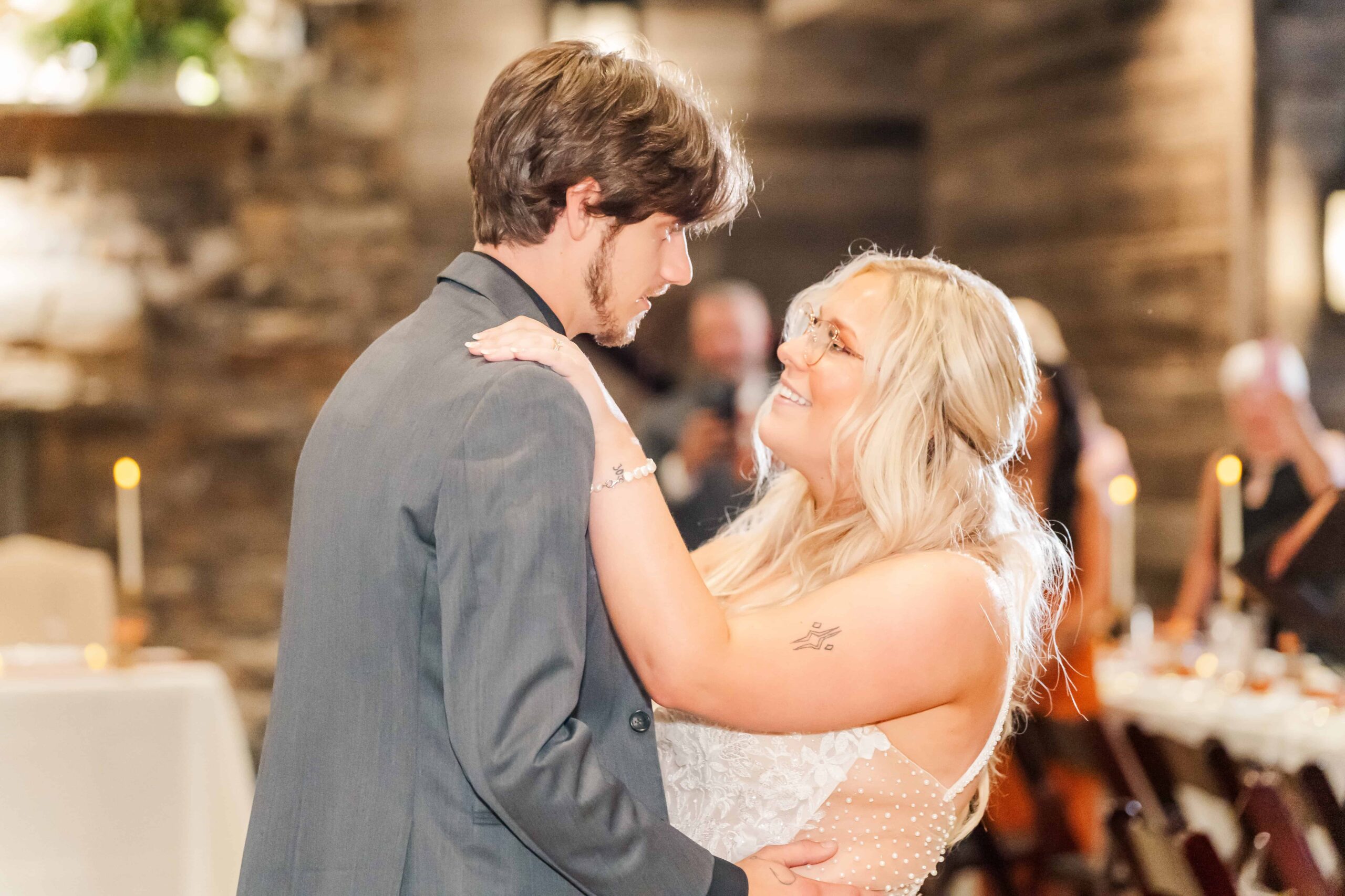 Wedding photographers capturing candid moments of the newlyweds dancing