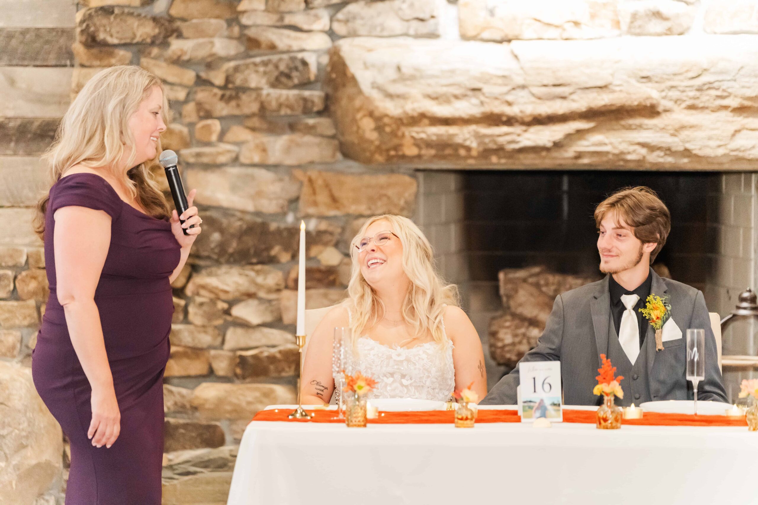 Mother of the bride giving emotional speech during wedding reception