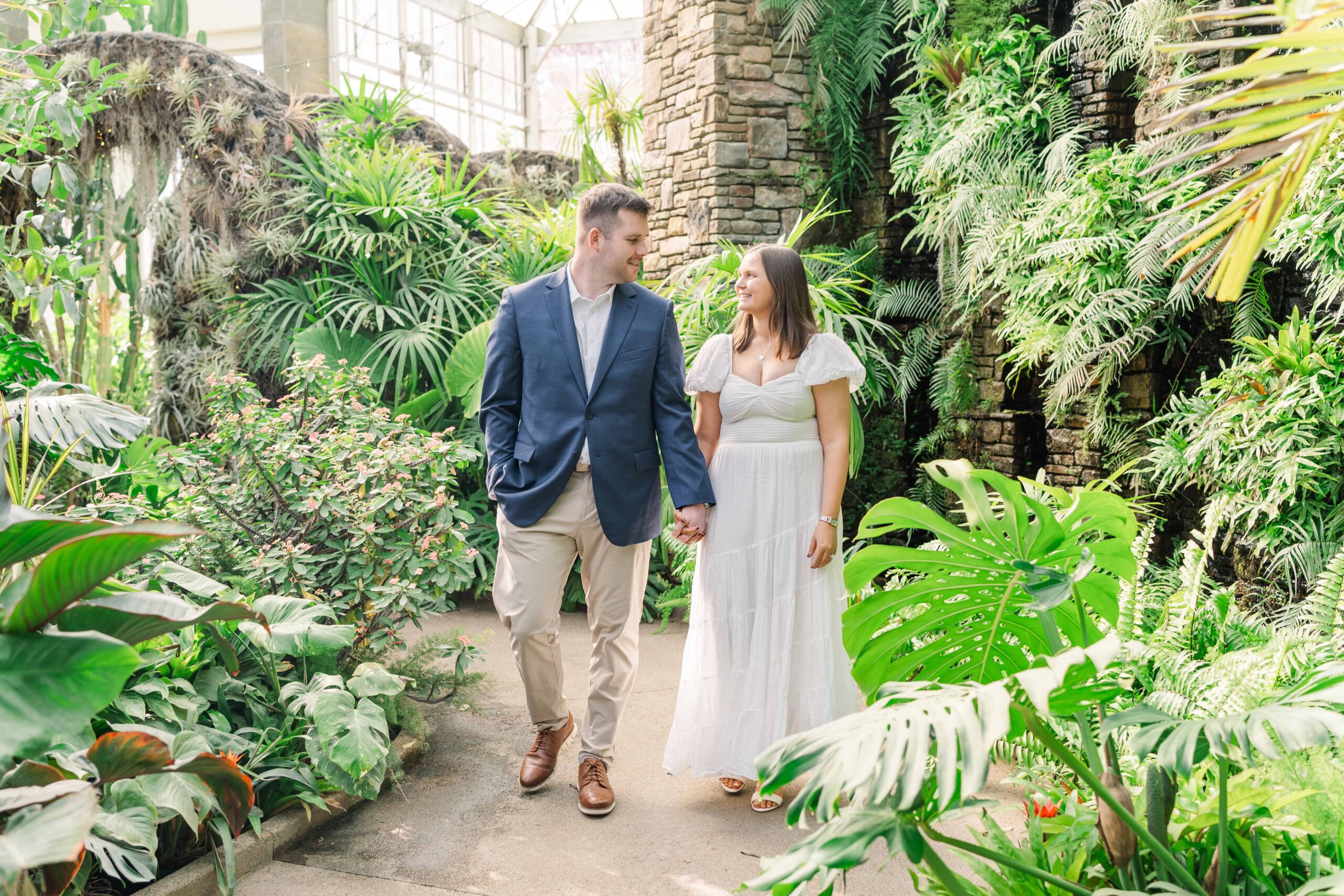 Couple walking through Daniel Stowe Botanical Gardens pathways