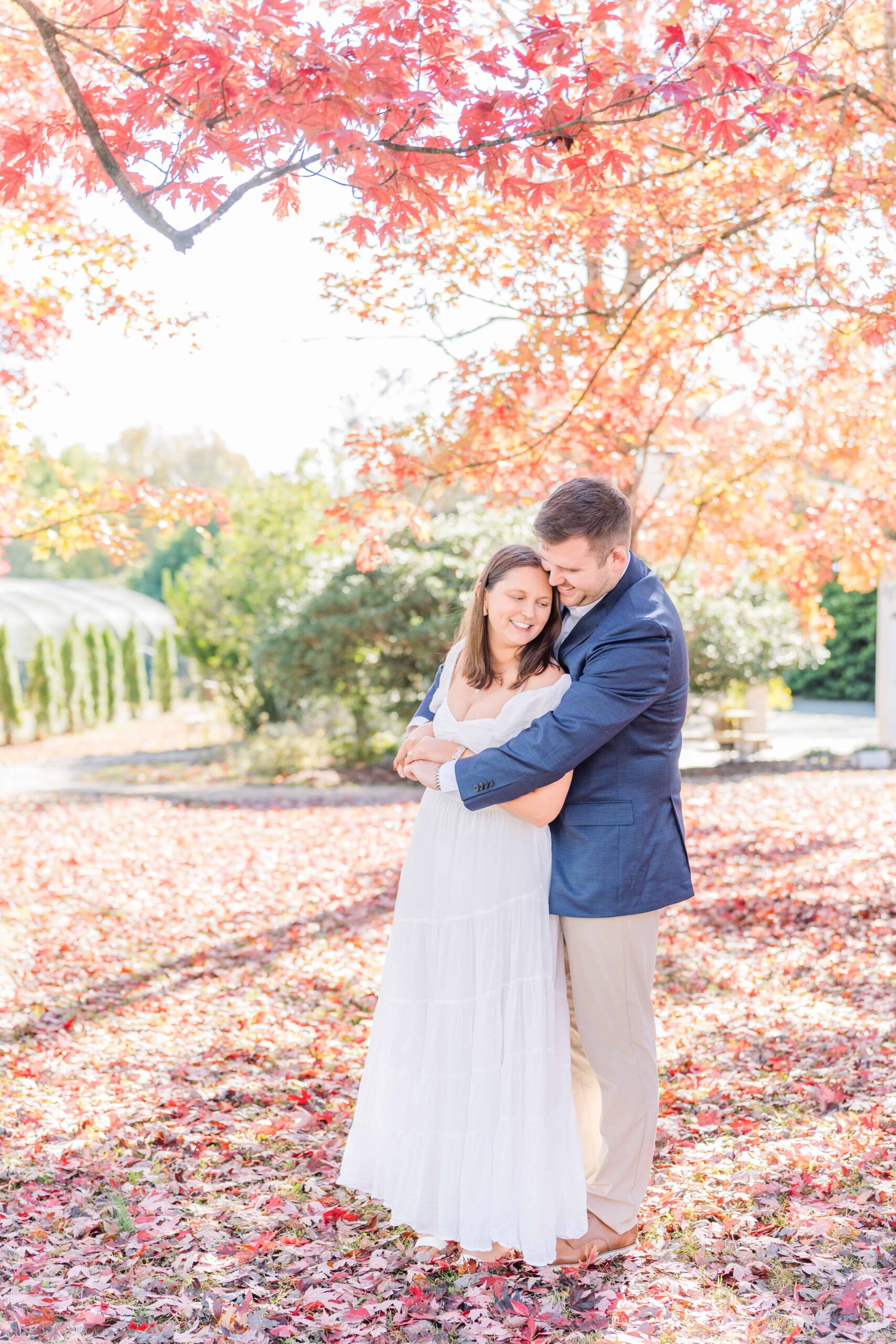 Engagement photo session under colorful autumn trees