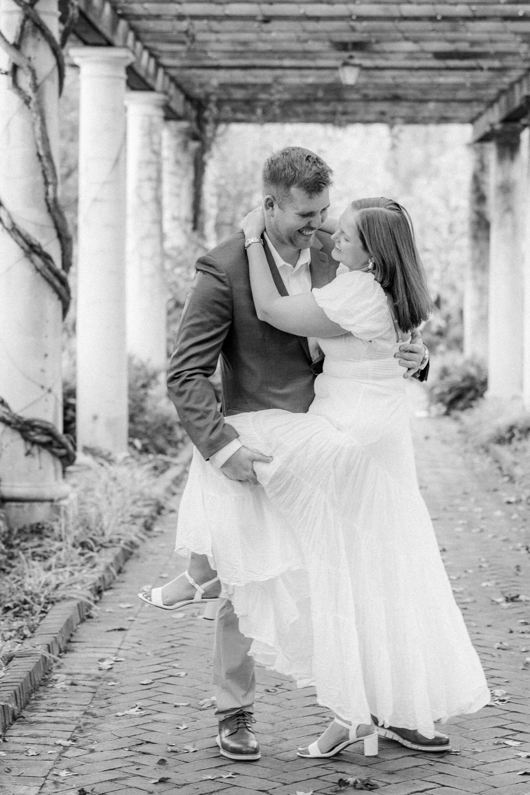 Couple laughing during fall engagement photos in North Carolina
