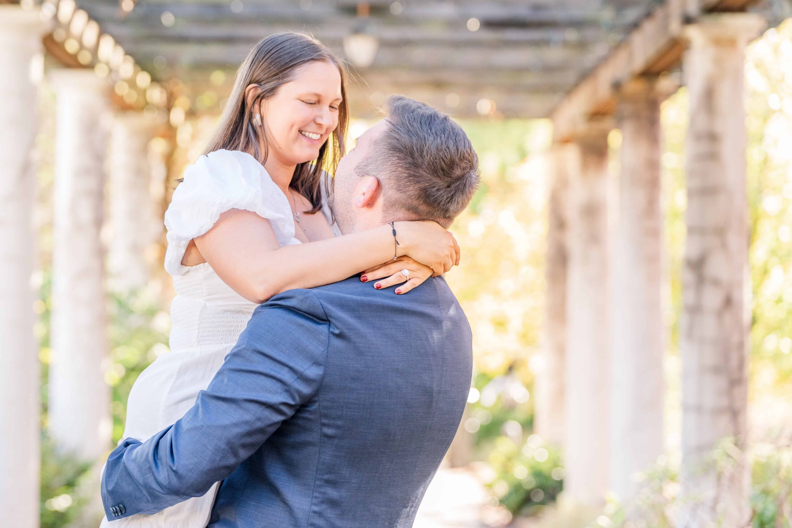 Couple laughing together during Charlotte garden engagement session
