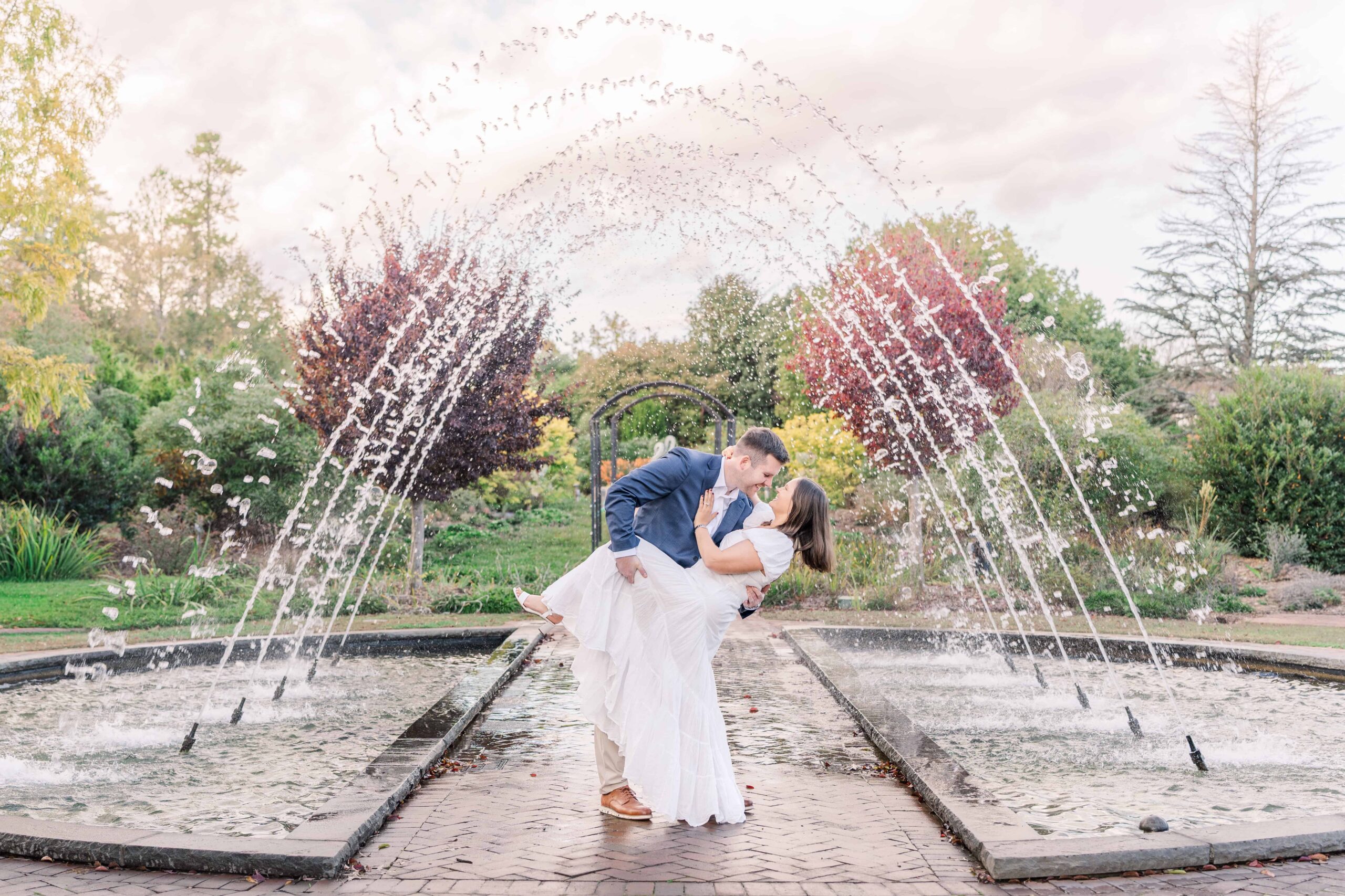 Engagement photo session under colorful autumn trees