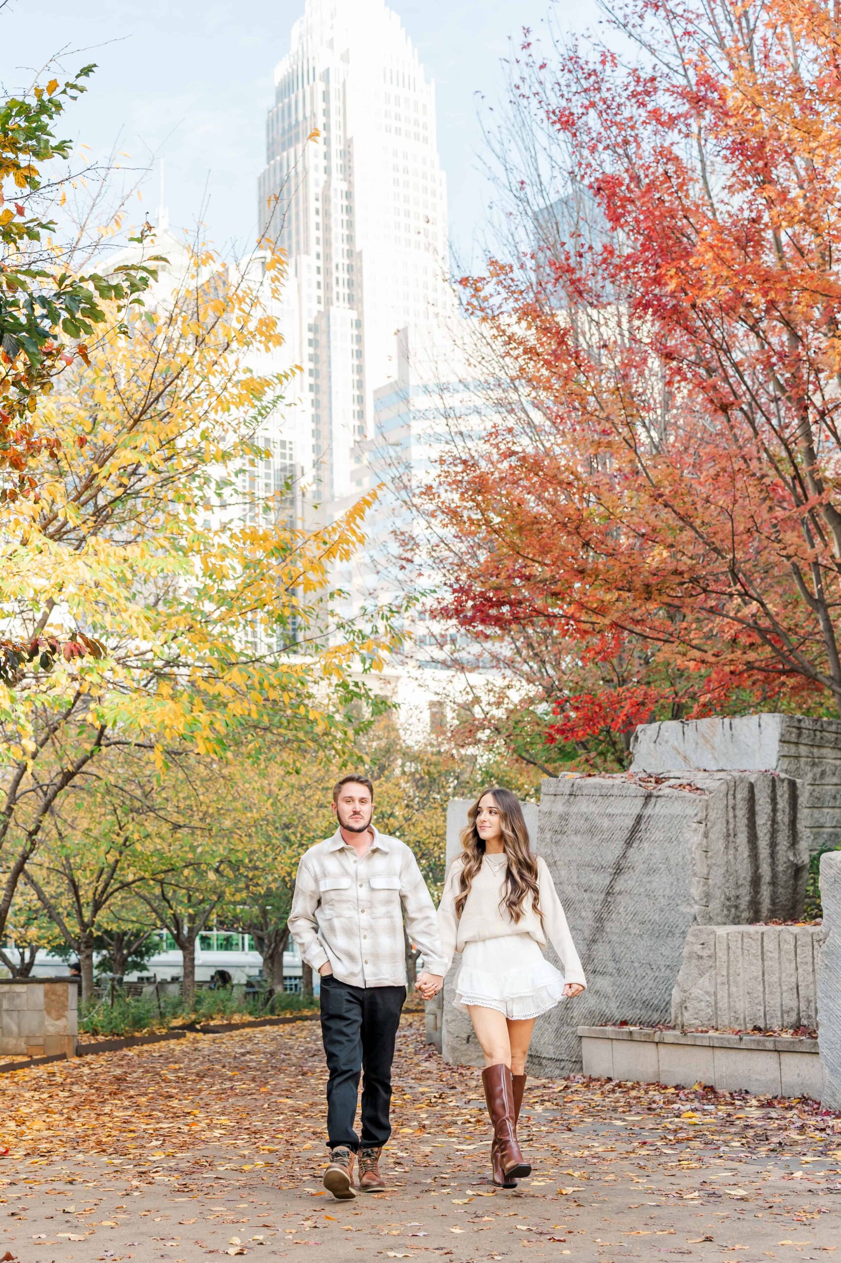 Couple walking toward Romare Bearden Park during session