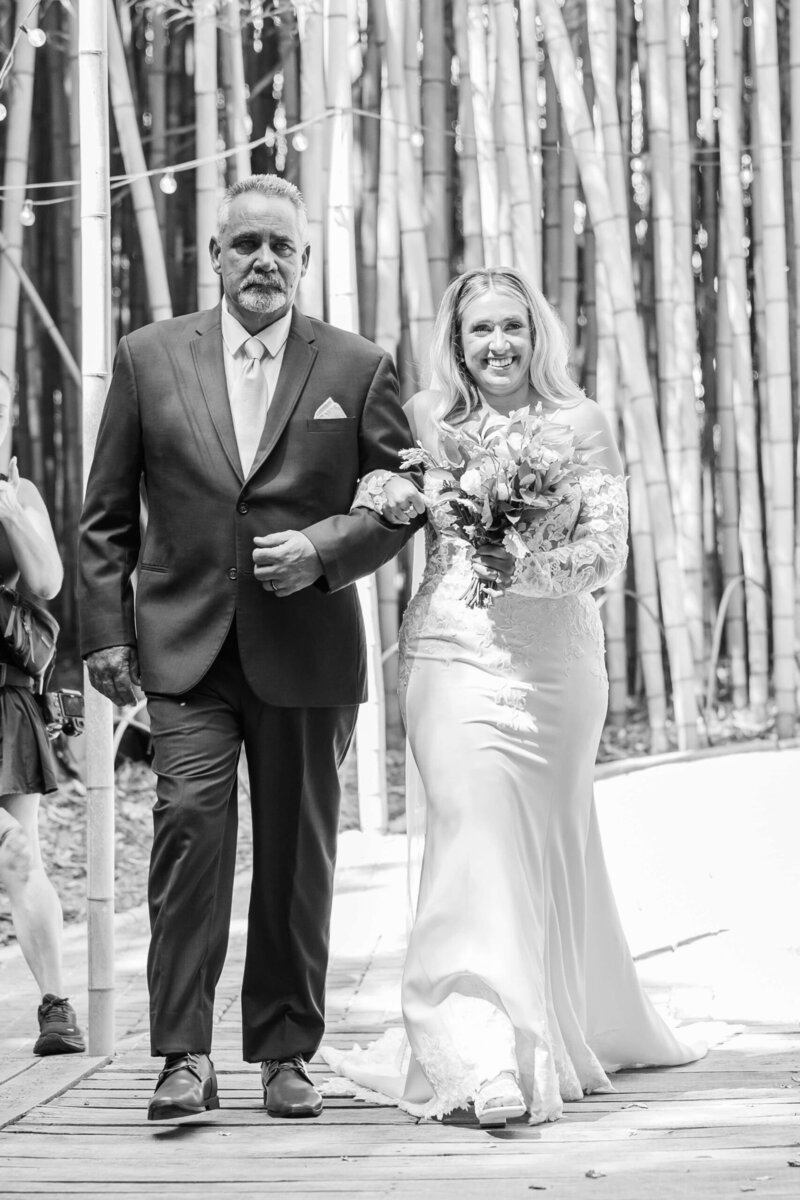 Bride walking down the aisle at Camelot Meadows Wedding