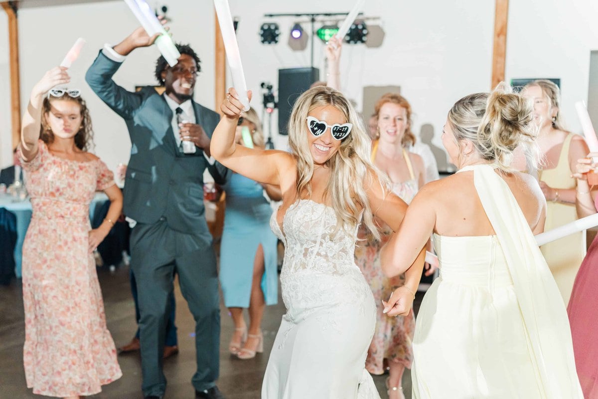 Bride laughing during their Camelot Meadows Wedding reception