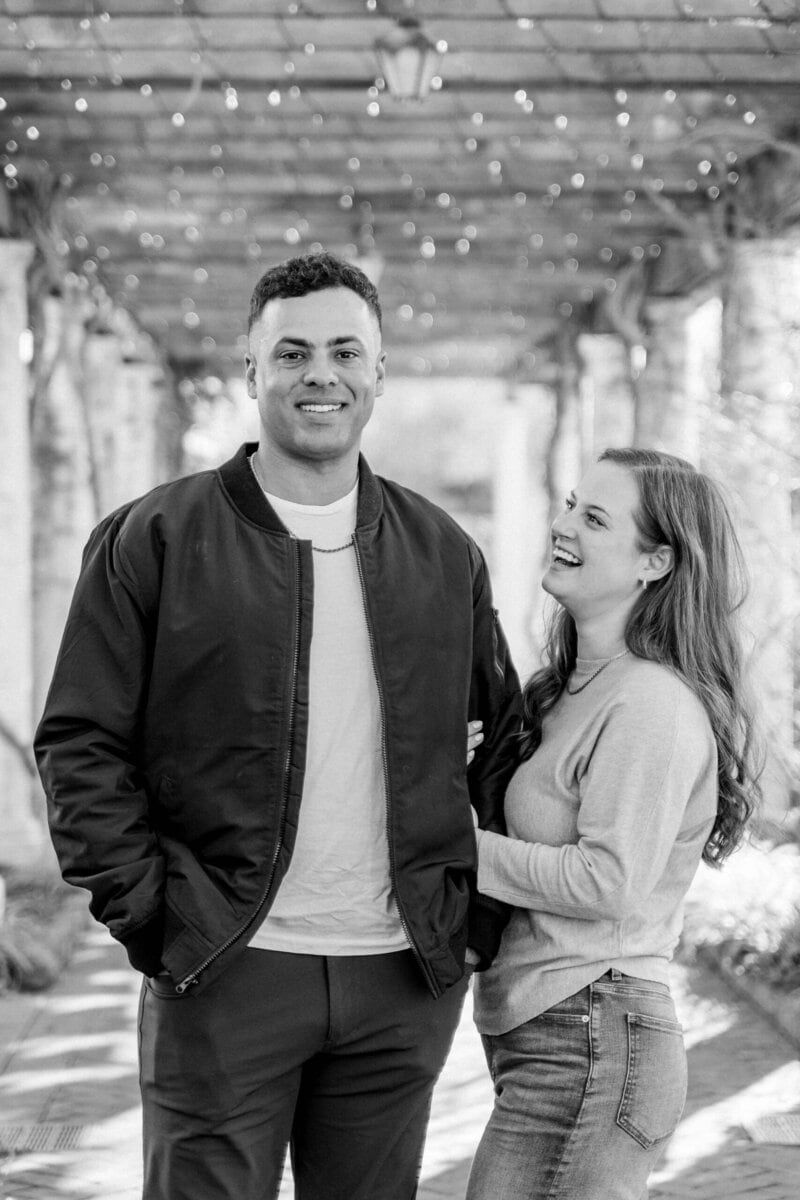 Couple laughing during winter engagement session in Charlotte