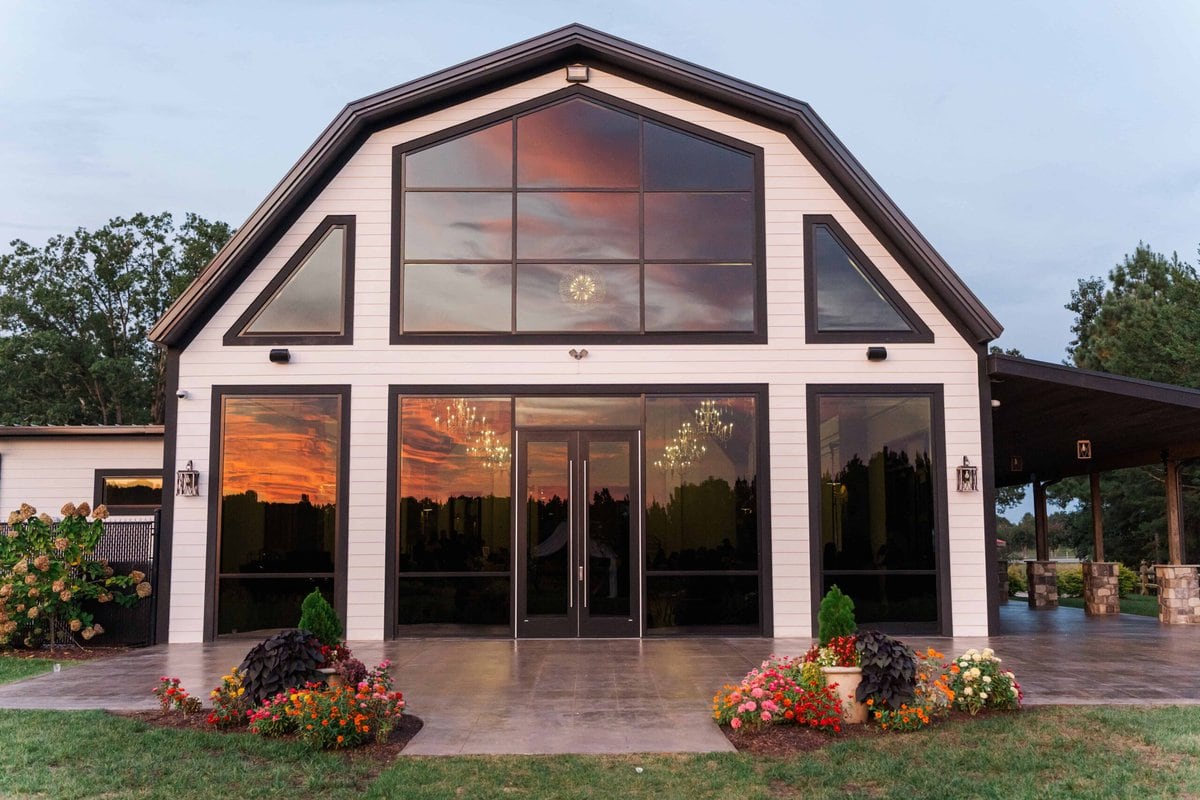 Wall of windows outside Dugaren Venues & Vineyards wedding venue