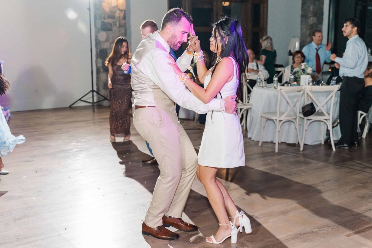 Bride and groom dancing during Dugaren Vineyards Wedding